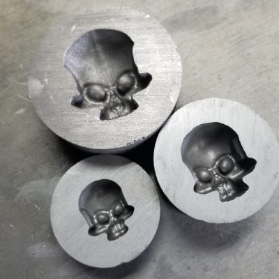 3 skull molds in graphite